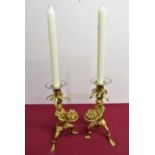 A pair of gilt metal monkey candlesticks with detachable glass gilt rimmed sconces (H22cm)
