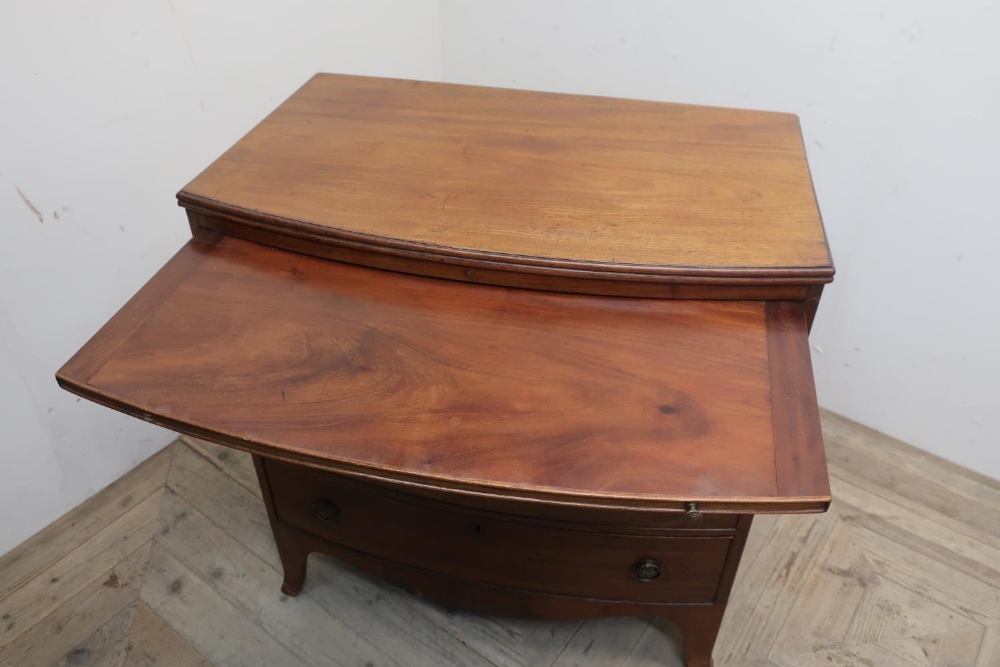 Early 19th C mahogany bow front dressing chest, moulded top above brushing slide and four - Image 2 of 2