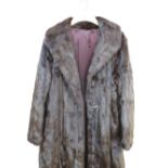 Ladies mink coat with silk lining, another fur coat and and two fox stoles.