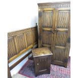 Good quality reproduction oak wardrobe, enclosed by two triple linen fold panel doors with paneled