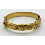 Victorian 9ct gold hinged bangle with bright coloured decoration