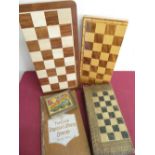 Three chess sets in folding cases, The Club Draughts and Chessboard and a set of Globe Series