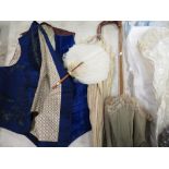 Blue velvet double breasted dress waistcoat, an embroidered silk waistcoat, two parasols, a