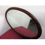 Edwardian oval bevelled edge wall mirror in inlaid mahogany frame