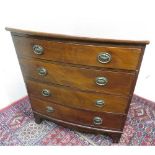A small early 20th C mahogany bow front chest with four long drawers on bracket feet (W70cm x