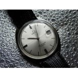 Omega Seamaster Cosmic hand wound wristwatch with date. Stainless steel case on leather strap.