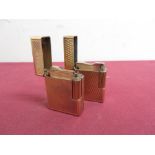 Two DuPont gold plated pocket cigarette lighters, textured design (H4.5cm) stamped BG8927 and BL6514
