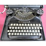 Corona four portable typewriter with qwerty keyboard in fitted case