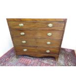 19th C mahogany chest of four long graduated cock-beaded drawers with oval brass handles and on