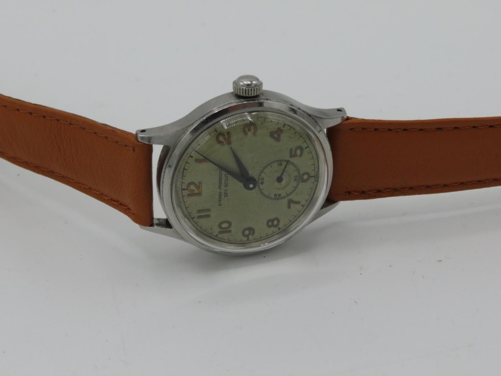 Girard Perregaux Sea Scout hand wound wrist watch. Stainless steel case on leather strap
