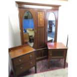 Edwardian inlaid mahogany wardrobe enclosed by a pair of mirror doors above two drawers on plinth