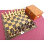 Large turned boxwood and walnut chess set with weighted bases, on rosewood and satinwood chess board