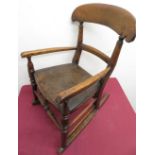 Victorian child's ash rocking chair with curved cresting rail on later solid seat, turned supports