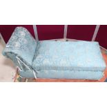 Blue upholstered ottoman with scroll end
