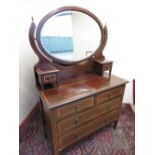 Edwardian inlaid mahogany dressing chest, with oval mirror above two long and two short drawers. (