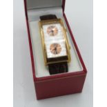 Coca Cola twin dial quartz wristwatch, rectangular copper coloured plated case on leather strap,