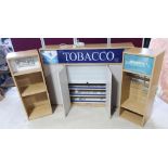 Newsagents illuminated Tobacco dispensing cabinet, roller shutter enclosed by a pair of doors (