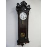 Victorian grained as walnut Vienna type wall clock, with pierced cresting, white Roman dial and