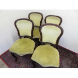 Set of four Victorian mahogany framed dinning chairs with shield shaped back serpentine seats and on