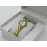 Seiko Coutra lady's quartz wristwatch with date. Gold plated case on matching bracelet. Case back