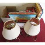 Pair of bronze effect table lamps and a selection of games including Mastermind, Lexicon, etc