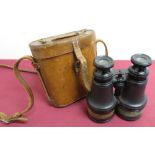 Early 20th C Galilean 12x field glasses, in tan leather case