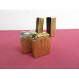 Two DuPont gold plated pocket cigarette lighters, textured design (H4.5cm) stamped A9CC83 and K9CR08