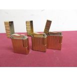 Three DuPont gold plated pocket cigarette lighters, striped design (H4.5cm) stamped DT1107, EB5413