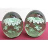 Victorian green glass dump paper weights with inclusions. (2) (1AF)