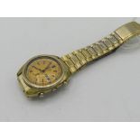 Seiko automatic chronograph with day date. Gold plated case on gold plated bracelet. Case back