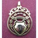 9ct two colour gold hallmarked fob of open work wreath form, initialled W.J.L and engraved