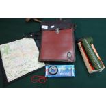 Part leather folding map case, a modern map case, compass and right angled torch