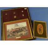 Framed montage of the Battle of Isandlwana and various badges relating to 24th regiment on foot (