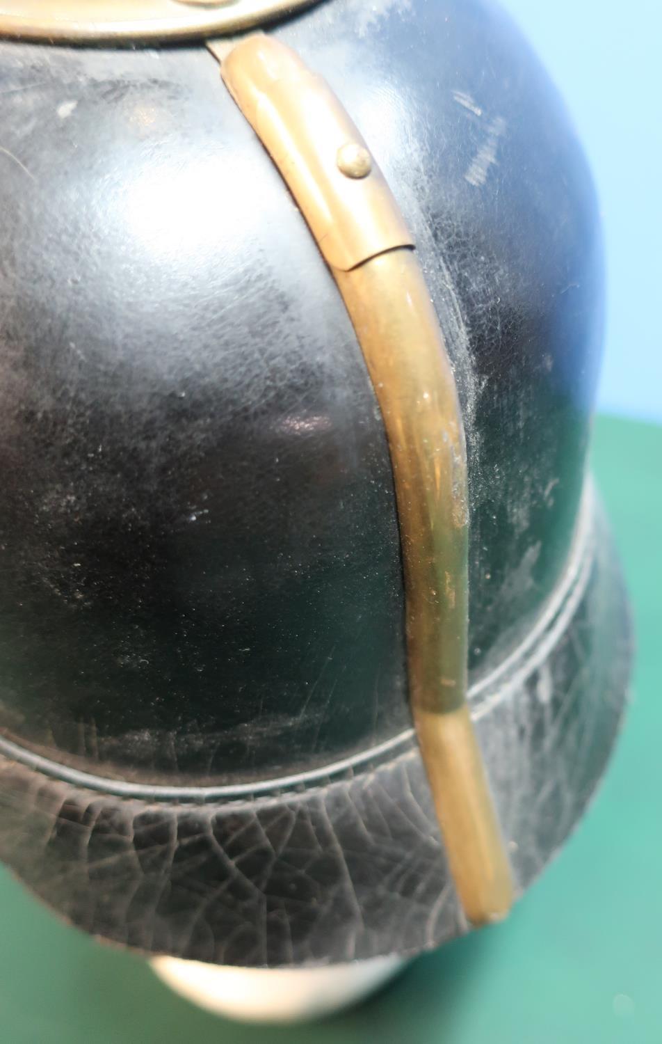 WWI Prussian leather bodied pickelhaube helmet with raised brass spike and central crest badge - Image 4 of 4