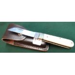 Sheffield made single bladed pocket knife with ivory grips and working back detail, with leather