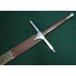 Extremely large decorative broad sword with steel cross piece, leather bound grip and first