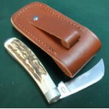 Single bladed Sheffield made pruning type knife with two piece antler horn grips, with leather