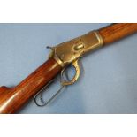 Winchester under lever 38 WCF rifle, with 23 inch octagonal barrel, engraved to the top rib "