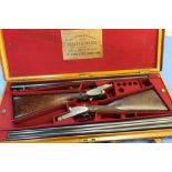 Cased pair of Hussey & Hussey 12B side by side sidelock ejector shotguns, with 28 inch barrels, 2