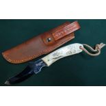 Harry Boden skinning knife 2.5" blade slightly curved with sambar horn grips, tooled leather belt