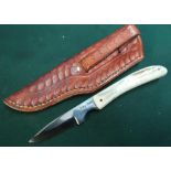 Small two inch bladed Harry Boden sheath knife with two piece sambar horn grips