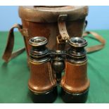 Cased pair of leather bound binoculars the case marked with binocular prismatic No6 case Mk1 with