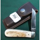 Single bladed Sheffield made pocket knife with two piece Sambar horn grips and leather belt pouch