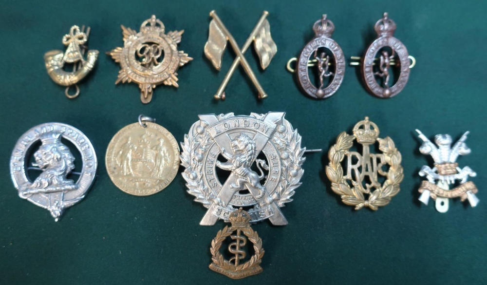 Small selection of various British military cap and lapel badges and a Great War Birmingham Peace