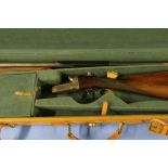 Tan leather cased deactivated Dumoulin & Co 12 bore side-by-side shotgun with 28 inch barrels in