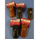 Five as new ex shop stock Whitby & Co folding knife leather belt sheathes