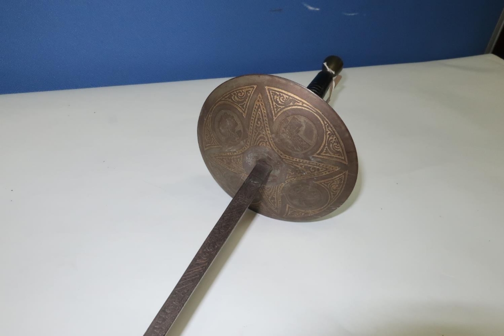 Late 19th C Spanish fencing foil with discus shaped guard and ribbed wooden grip with urn shaped