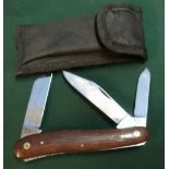Triple bladed I.XL texas stock knife with two piece wooden grips