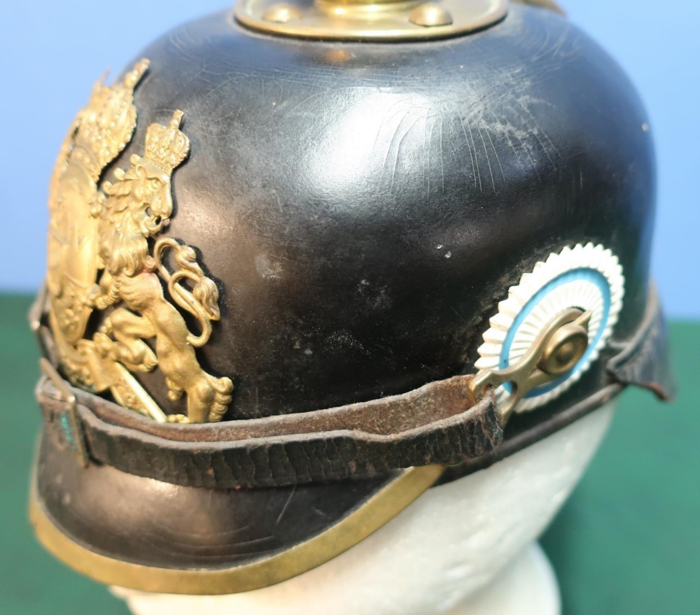 WWI Prussian leather bodied pickelhaube helmet with raised brass spike and central crest badge - Image 2 of 4
