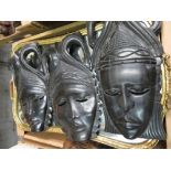 Three carved hardwood wall masks, an Indian pierced table box, a gilt framed wall mirror, a carved